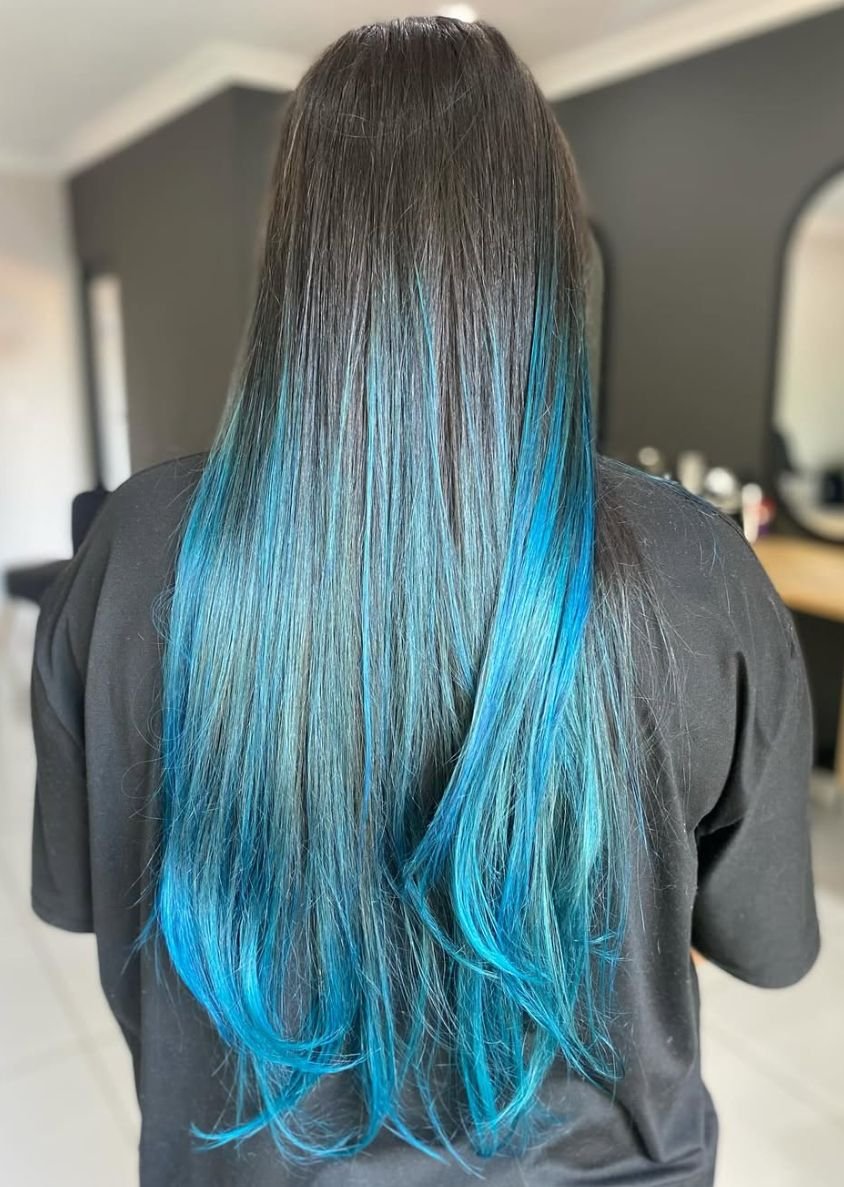Long brunette hair with bright blue ombre tips